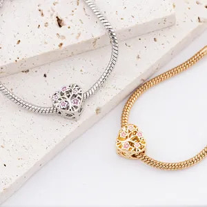 Silver and gold tree of life heart pendant bracelets on snake chains with pink enamel flowers