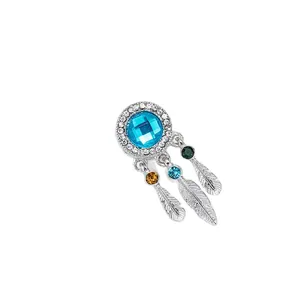 Elegant dreamcatcher charm with blue center stone and colorful feather pendants