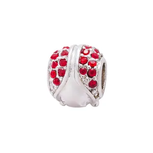 Macro view of ladybug bead charm with red rhinestones for DIY bracelets