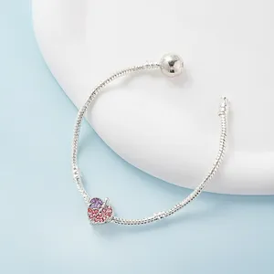 Silver snake chain bracelet featuring a leaf charm with pink-purple gradient stones