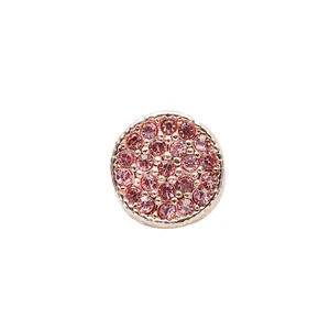 Close-up of sparkling pink crystal pave bead charm with rose gold plating details