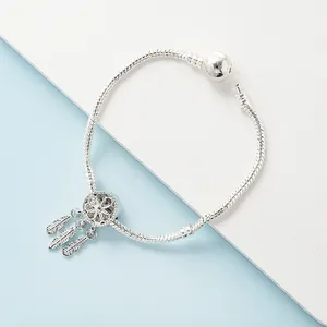 Silver dreamcatcher charm bracelet with feathers on a snake chain and bead clasp