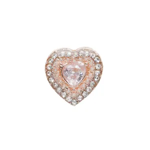 Close-up of rose gold heart charm with large central zircon and pavé crystal border