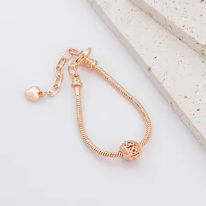 Bracciale a catena snake oro rosa con perla floreale traforata e ciondolo a cuore