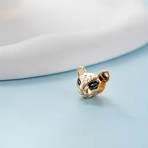 Elegant gold leopard head charm with black enamel eyes and detailed spots for DIY bracelets