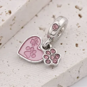 Pink enamel heart and cat paw charm in silver metal with sparkling pink zircon crystals