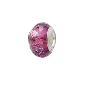 Macro shot of faceted purple glass bead with silver core and S925 engraving charm