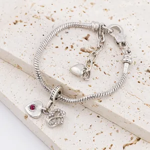 Silver snake chain bracelet with sparkling red heart charm and pave crystal pendants