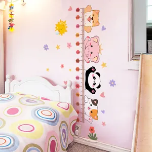 Close-up of animal height chart with cute shiba inu, panda and elephant stickers