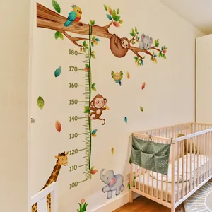 Detail of colorful animal growth chart wall sticker showing jungle animals and height scale