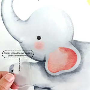 Detail of peeling watercolor elephant wall sticker showing self-adhesive backing and removal