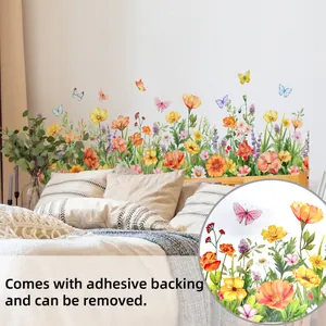 Detail of self-adhesive watercolor floral wall stickers featuring colorful butterflies and daisies