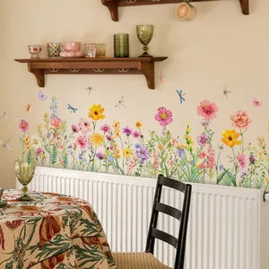 Detailed view of watercolor flower and dragonfly wall stickers in a cozy home setting