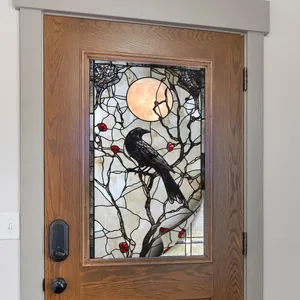 Stained glass style window film featuring a bird on a branch with a full moon backdrop