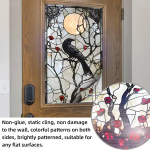 Detail of static cling bird sticker on glass showing vibrant double-sided gothic moon art