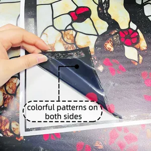 Close-up of double-sided bird floral glass sticker showing vivid patterns on both sides