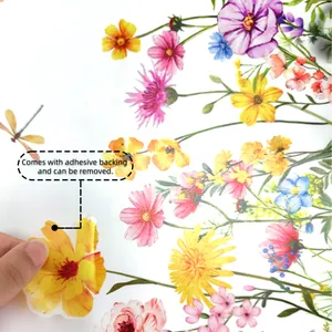Detail showing hand peeling self-adhesive floral wall sticker with dragonfly and flowers