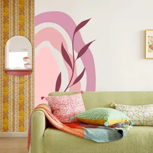 Abstract rainbow and botanical wall sticker in a modern bohemian living room setting