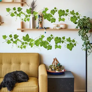 Detail of green vine wall decals with realistic texture on a white indoor wall