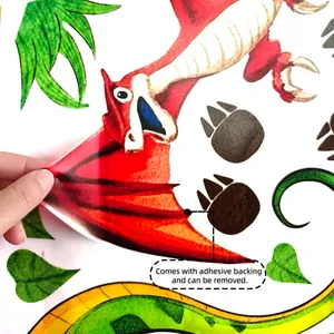 Detail showing hand peeling a dinosaur wall sticker with removable adhesive backing