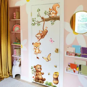 Cartoon animal wall decals with monkeys and bears on tree branches for kids room decor