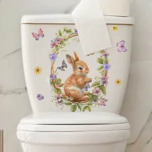 Self-adhesive watercolor rabbit and floral wreath sticker on white toilet ceramic tank