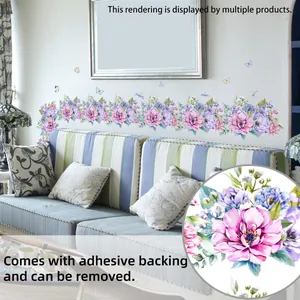 Detail of floral wall decals with pink flowers and butterflies on a living room sofa wall