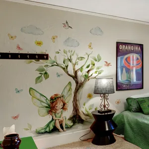 Detail of cartoon fairy and big tree wall stickers in a warm children's bedroom setting