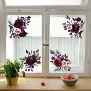 Detail view of colorful floral static window decals featuring pink and purple rose bouquets
