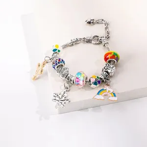 Bracciale natalizio con charms in lega perline colorate e ciondolo animale dorato