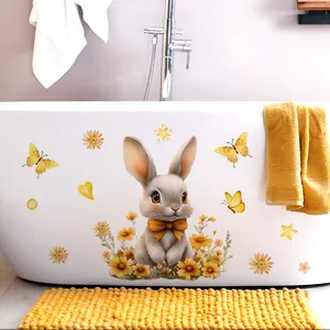 Vue détaillée de stickers lapin jaune sur une baignoire blanche avec motifs tournesols