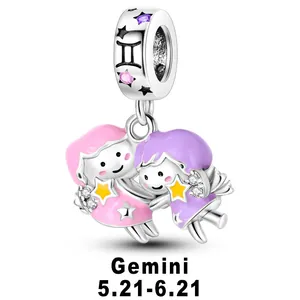 Detail of Gemini zodiac charm with colorful enamel twin figures and sparkling zircons