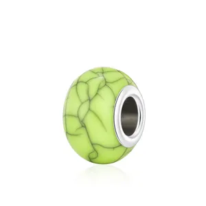 Green faux turquoise resin charm bead with black marble texture and silver metal core
