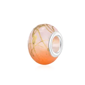 Polished resin beads with gradient pink and orange effect and golden silk textures