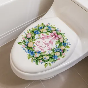 Détail du sticker de toilette Happy Easter avec œufs colorés et couronne fleurie