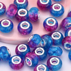 Macro detail of 14mm resin beads with blue purple glitter and silver metal core