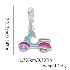 Macro view of blue enamel scooter charm with dimensions showing height and weight details