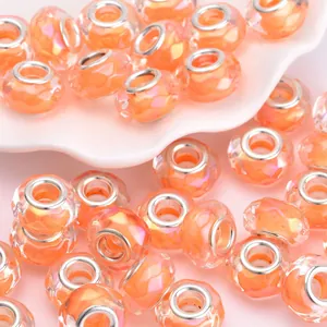 Polierte orangefarbene facettierte Harzperlen mit Silbermetallkern für DIY Schmuck