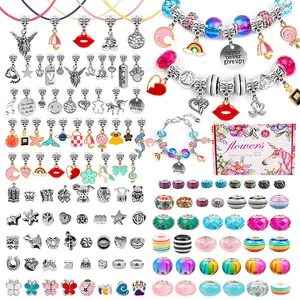 DIY charm bracelet making kit for kids with silver pendants and beads in a pink gift box