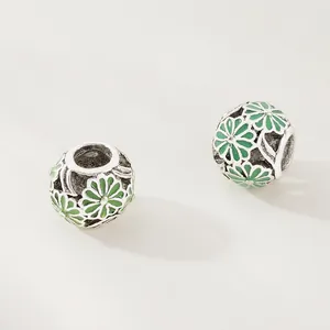 Hollow sphere charms with green daisy patterns for DIY jewelry bracelets and necklaces