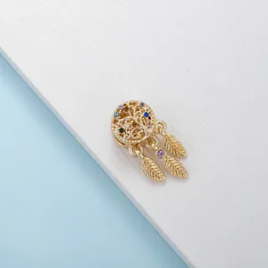 Golden dreamcatcher pendant charm with multicolored rhinestones and triple feather dangles