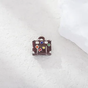 Perle de valise en émail marron avec des motifs colorés d'étoiles et de cœurs