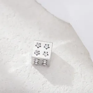 Silver alloy dice charm bead with star-shaped cubic zirconia inlay and sparkling finish