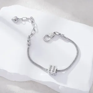 Silver snake chain bracelet with sparkling rhinestone star cube charm and heart pendant