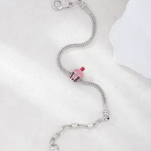 Exquisite cupcake charm bracelet in silver with pink enamel icing and cherry details