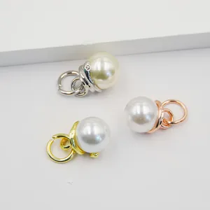 Three elegant snake-style pearl charms in gold, silver and rose gold metallic finishes