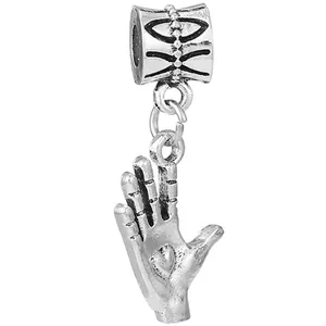 Silver Vulcan salute charm with heart detail and engraved bail on a white background