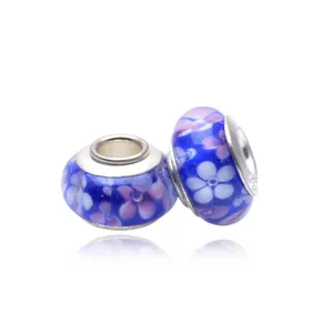 Detail of 925 stamped silver core on blue floral glass murano beads for DIY bracelets