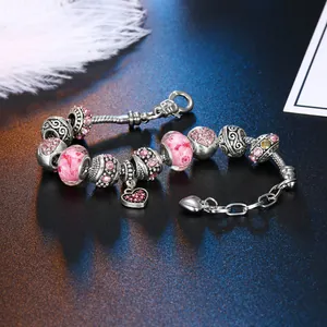 Pink acrylic beads and silver-plated alloy charm bracelet with heart pendant