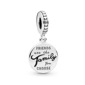 Silver round charm engraved with 'Friends are the family you choose' and heart relief